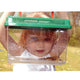 Young girl peering through the Observation house. Inside is a frog. 